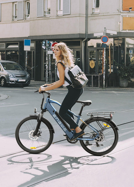 Engwe P26 Combo electric bike with a stylish woman riding in an urban environment